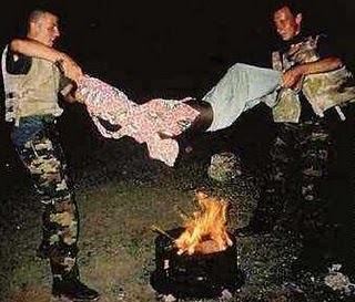 Belgian soldiers roasting a boy